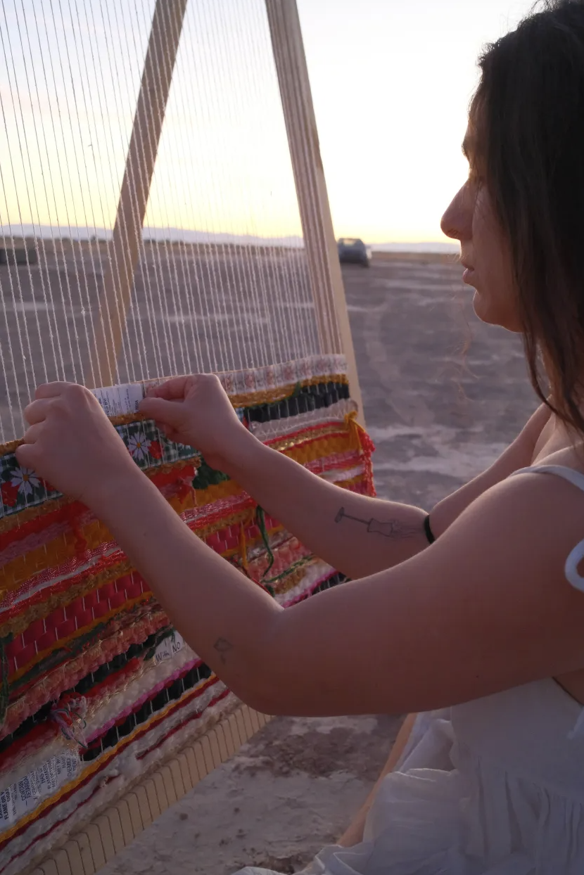 Weaving at sunset in the desert